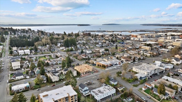 birds eye view of property featuring a water view