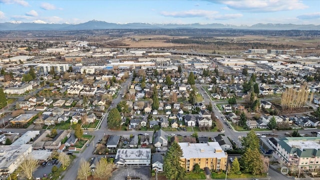 birds eye view of property featuring a mountain view