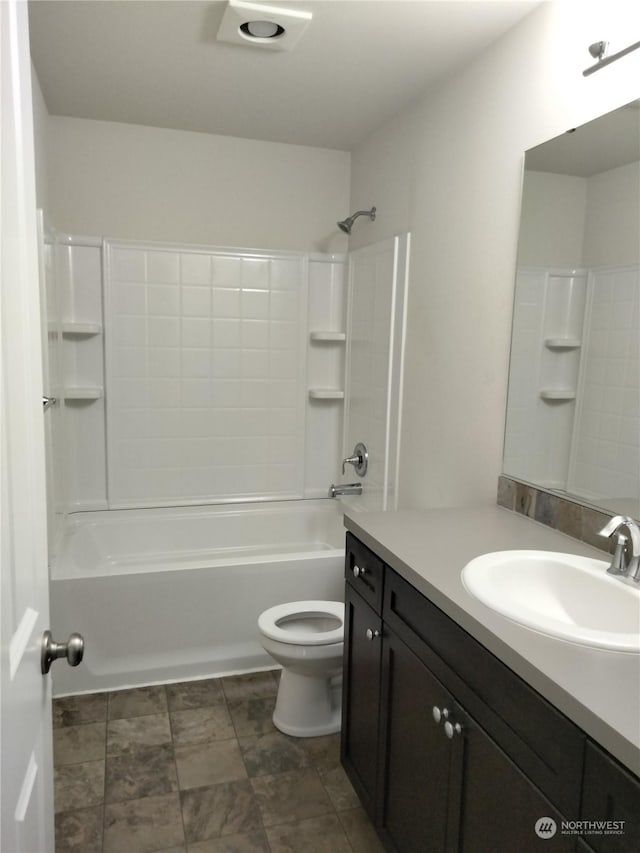 full bathroom featuring toilet, vanity, and  shower combination