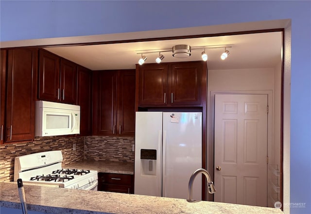 kitchen featuring white appliances and decorative backsplash