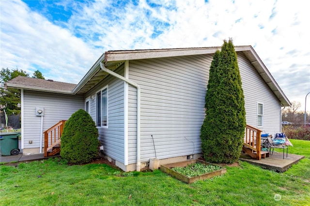 view of property exterior with a yard