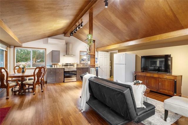 living room with light wood-type flooring, a wall unit AC, wooden ceiling, and vaulted ceiling with beams