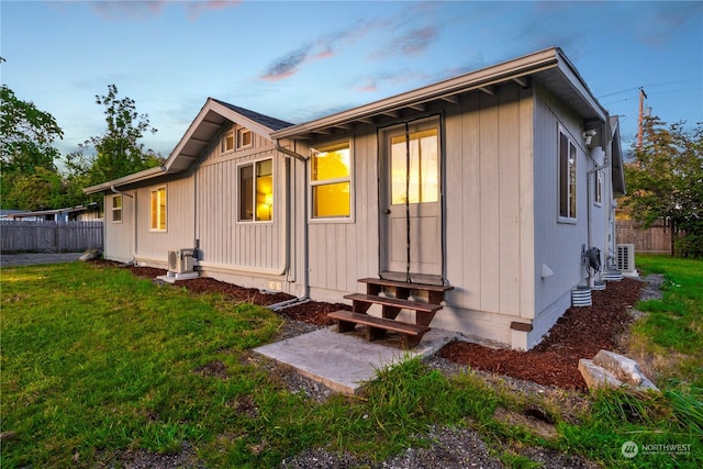 back house at dusk with a yard