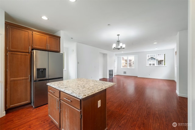 kitchen featuring a chandelier, stainless steel fridge with ice dispenser, a center island, pendant lighting, and dark hardwood / wood-style floors