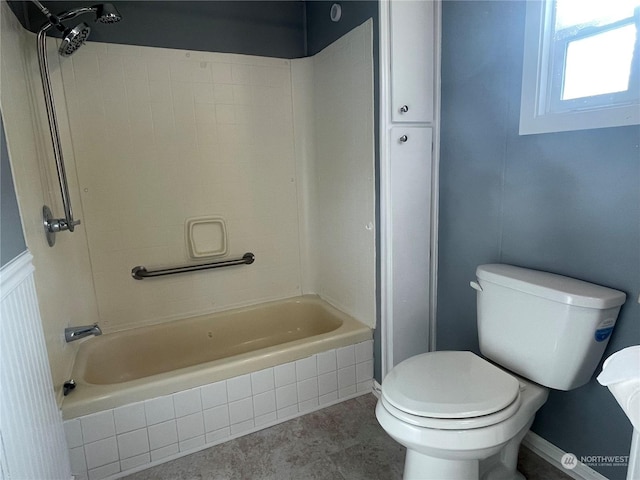 bathroom with toilet and shower / bath combination