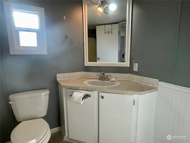 bathroom featuring toilet and vanity