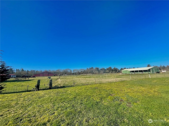 view of yard with a rural view