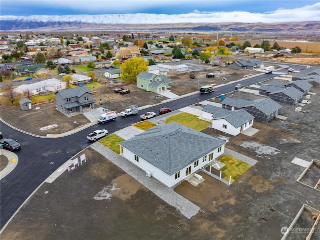 birds eye view of property with a mountain view