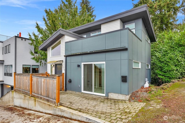 back of house with a patio