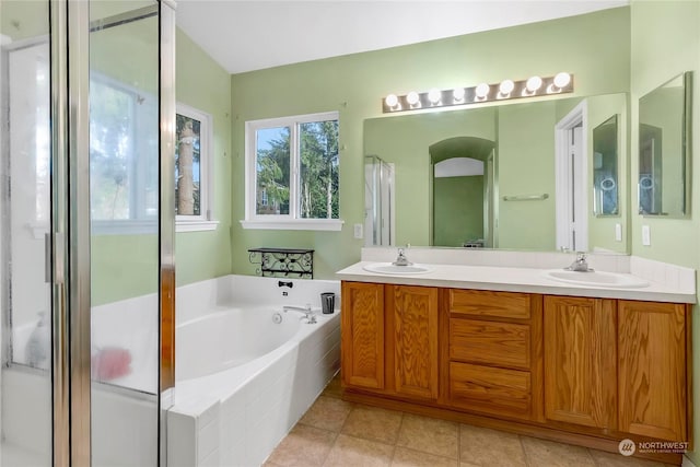 bathroom with vanity and independent shower and bath