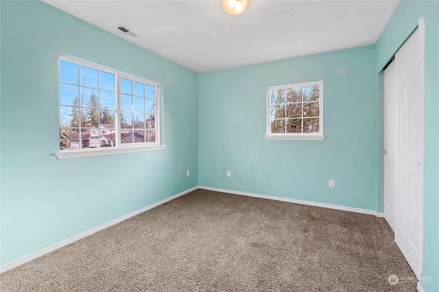 view of carpeted spare room