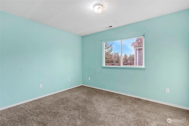 spare room featuring carpet floors