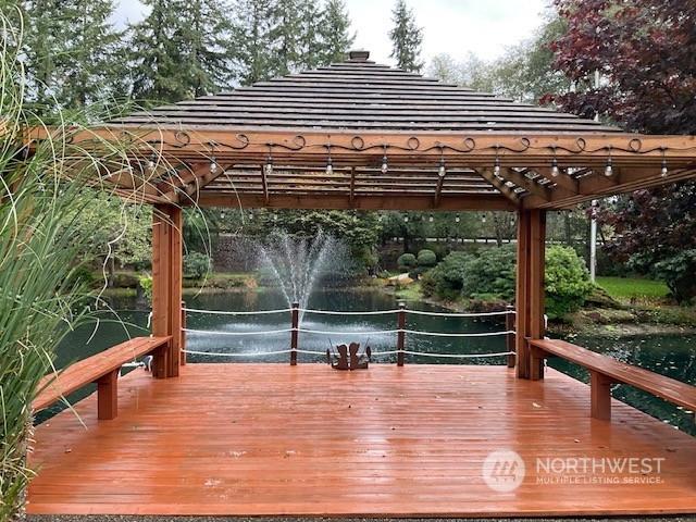 wooden terrace with a water view