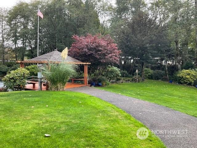 view of community featuring a gazebo and a yard