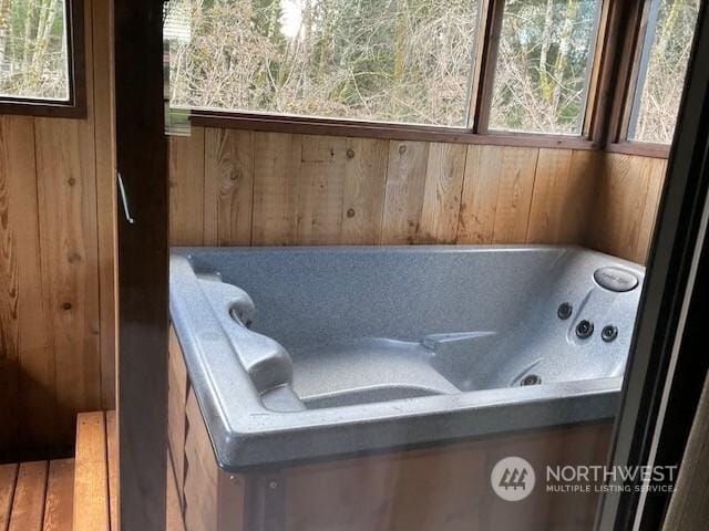 bathroom with wooden walls