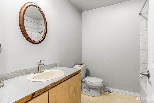 full bathroom featuring toilet, bathing tub / shower combination, and vanity