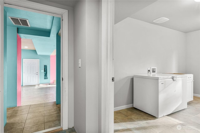 bathroom with tile patterned floors