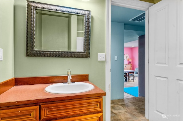 bathroom with tile patterned floors and vanity