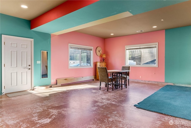 dining space with concrete floors