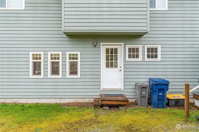 property entrance with a yard