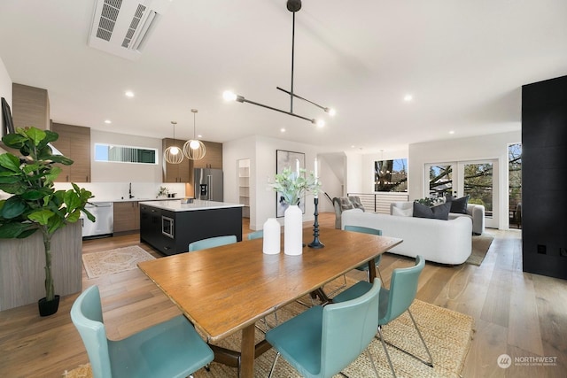 dining room featuring light hardwood / wood-style floors and sink