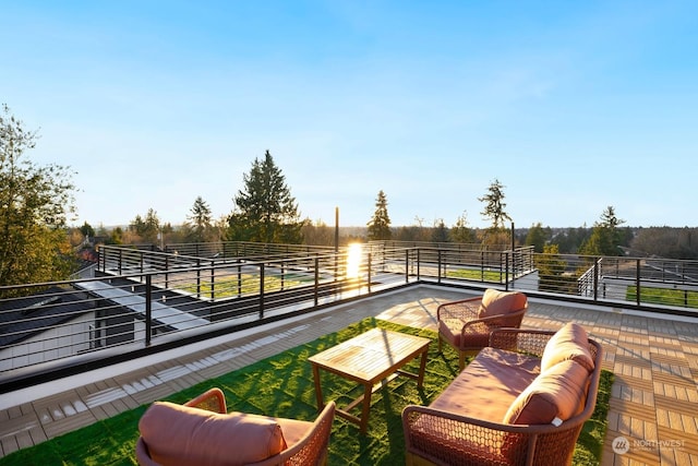 view of patio / terrace with a rural view and a balcony