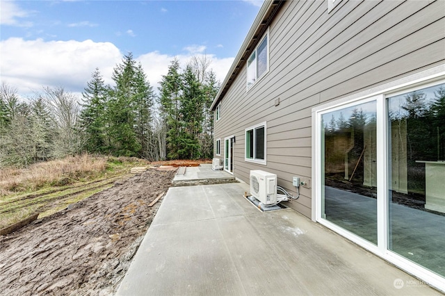 view of side of home featuring ac unit and a patio area