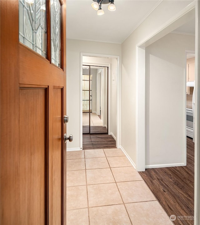 hallway featuring light tile patterned floors