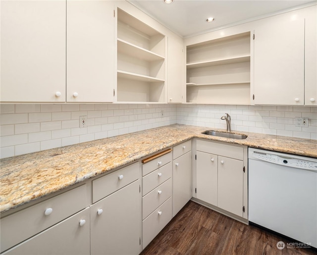 kitchen featuring white cabinets, dishwasher, light stone counters, and sink