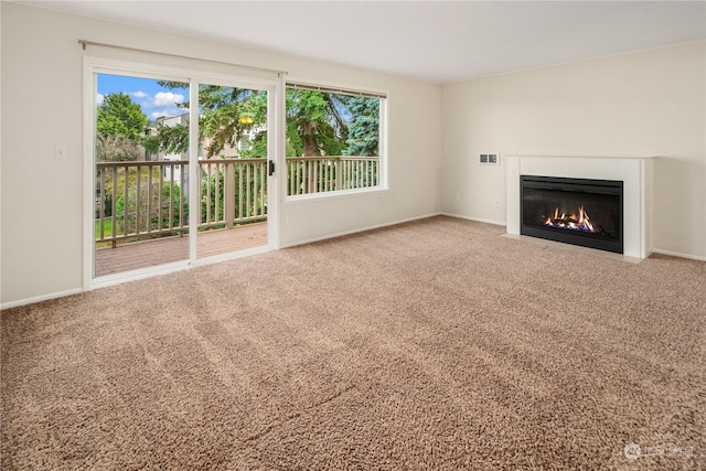 unfurnished living room with carpet