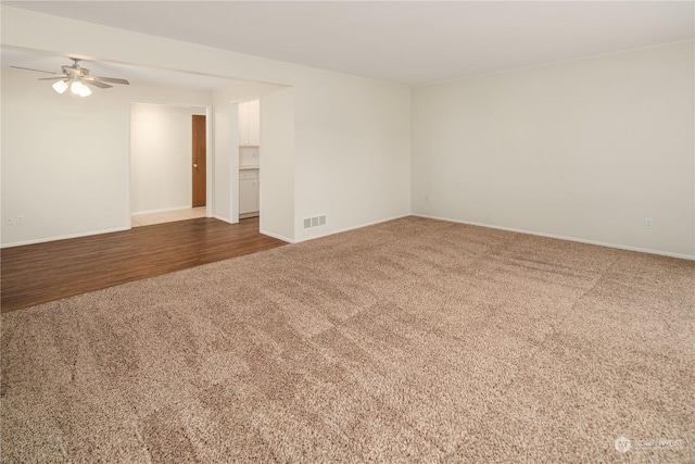 spare room with carpet floors and ceiling fan