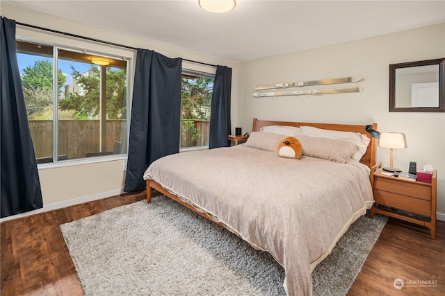 bedroom featuring dark hardwood / wood-style flooring