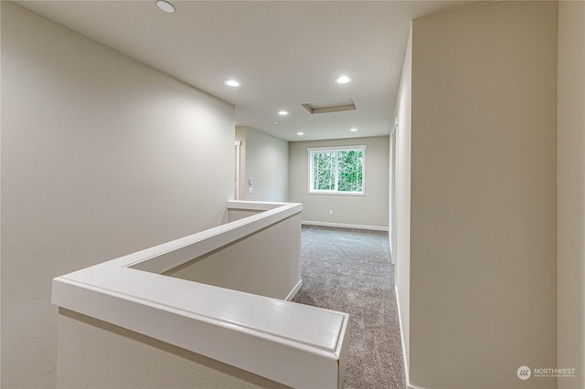 corridor with carpet flooring