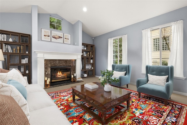 carpeted living room with lofted ceiling and a fireplace