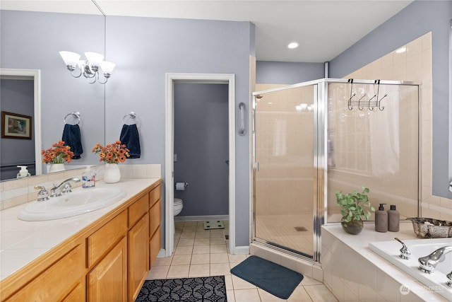 full bathroom with toilet, tile patterned floors, a chandelier, and independent shower and bath