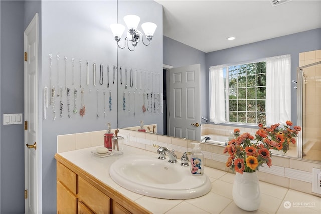 bathroom featuring vanity and shower with separate bathtub