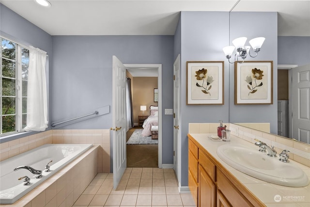 bathroom with a notable chandelier, a relaxing tiled tub, tile patterned floors, and vanity