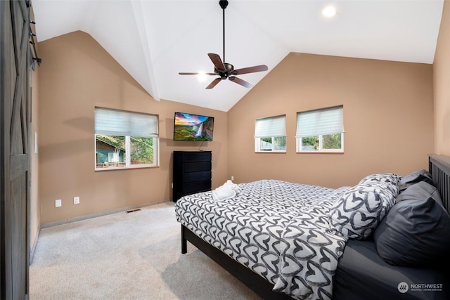 carpeted bedroom with ceiling fan and lofted ceiling