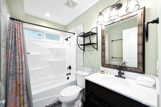 full bathroom with toilet, shower / tub combo, vanity, and tile walls