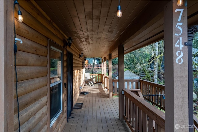 wooden terrace with a porch