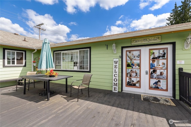 wooden deck featuring french doors