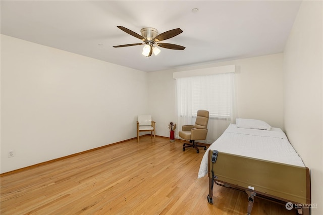 bedroom featuring ceiling fan and light hardwood / wood-style flooring