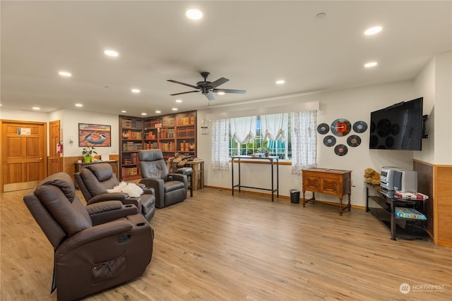 living room with light wood-type flooring and ceiling fan