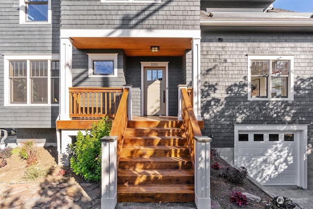 view of exterior entry with a garage