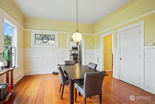 dining area featuring wood-type flooring