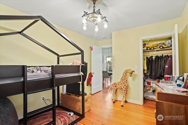 bedroom featuring light wood-type flooring and a closet