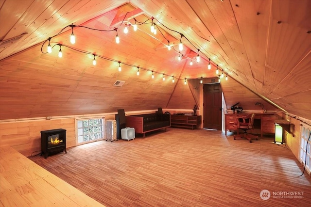 bonus room featuring vaulted ceiling, wooden ceiling, hardwood / wood-style flooring, and wooden walls