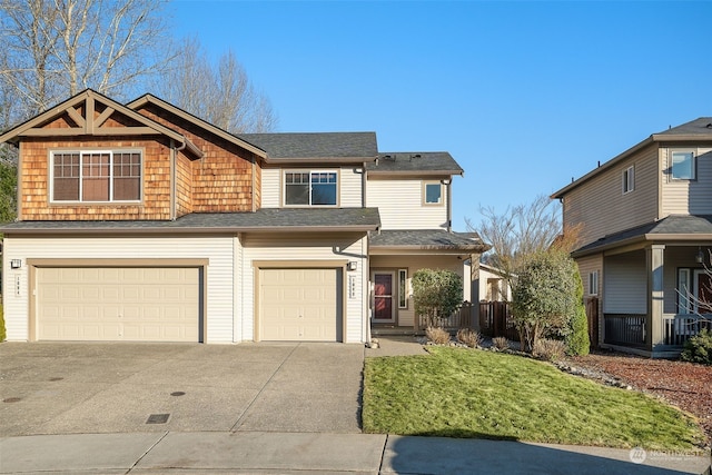 view of front property featuring a garage and a front lawn