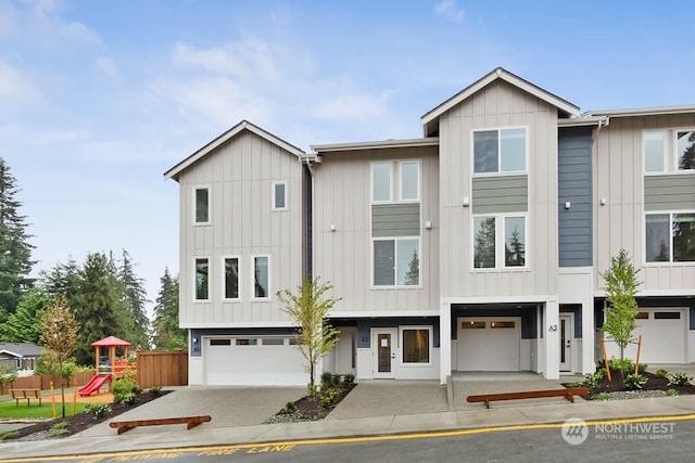 view of front of house featuring a garage and a playground