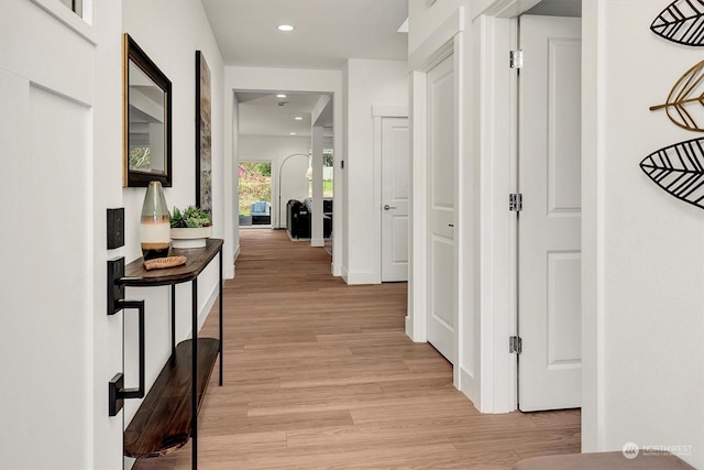 corridor featuring light hardwood / wood-style flooring